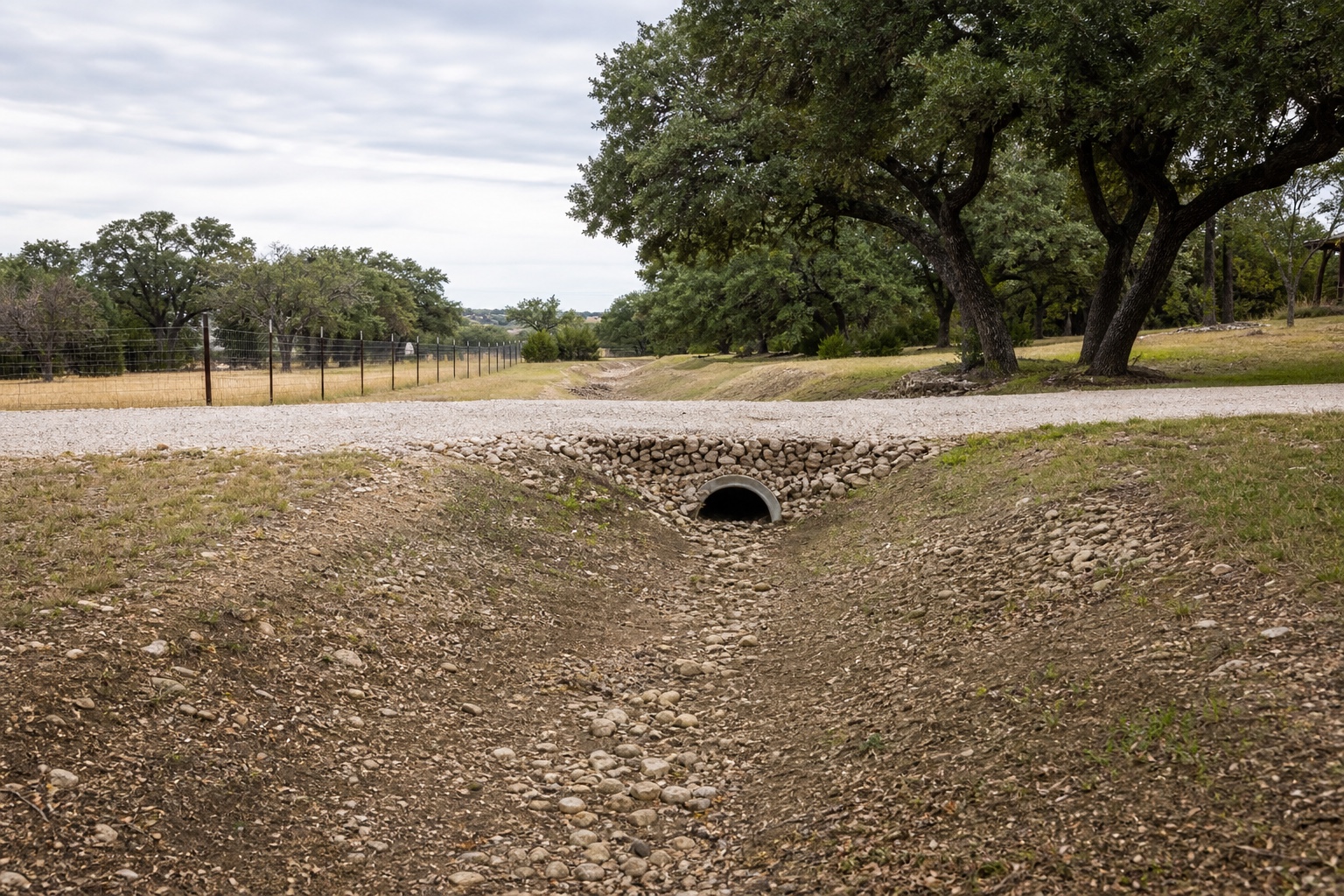 Graded drainage swale directing water away from a Temple-area property
